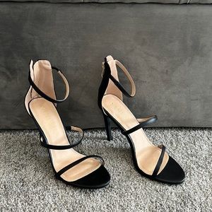Black heels never worn, 4.5”in  , zip up in back